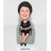 Lovely Mom Sitting on a Chair and Reading Newspaper Bobblehead
