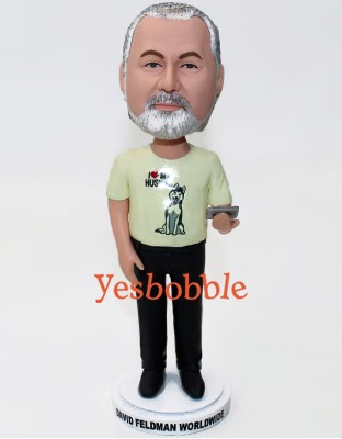 Bobblehead in Black Slacks and Yellow Shirt Holding a iPad