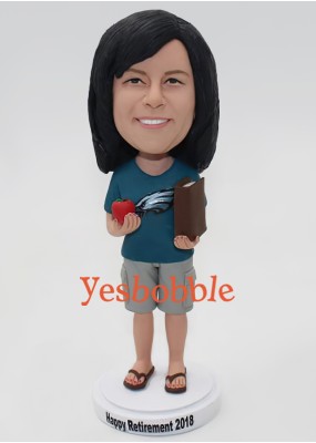Woman Holding a Book and a Tomato Bobblehead Woman Holding a Book and a Tomato Bobblehead