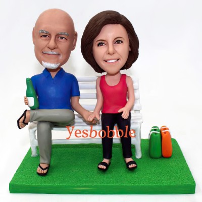 Couple Bobblehead Sitting On The Chair