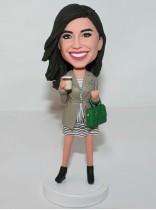 Lady Holding a Green Purse and Cup of Coffee Bobblehead Lady Holding a Green Purse and Cup of Coffee Bobblehead