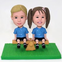 Cute Kids Sitting On Seesaw Bobblehead Cute Kids Sitting On Seesaw Bobblehead
