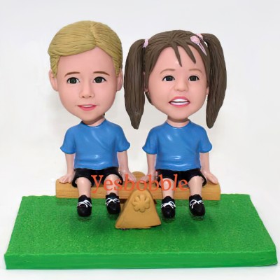 Cute Kids Sitting On Seesaw Bobblehead