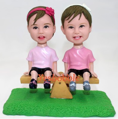 Girls Sitting On Seesaw Bobblehead