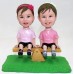 Girls Sitting On Seesaw Bobblehead