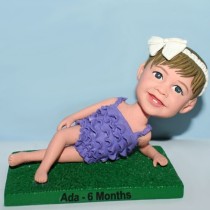 Little Girl Laying On The Grass Bobblehead Little Girl Laying On The Grass Bobblehead