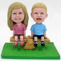 Little Kids Sitting On Seesaw Bobblehead Little Kids Sitting On Seesaw Bobblehead
