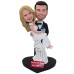 Bobblehead Groom Holding Bride Wedding Cake Topper